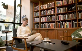 Free Stock Video Woman Using A Tablet By The Window
