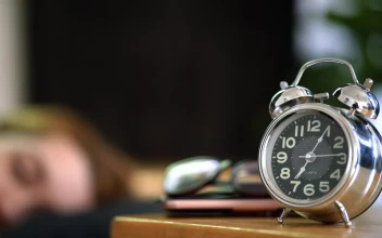 Free Stock Video Woman Turning Off Her Alarm Clock In The Morning