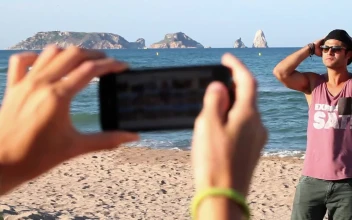 Free Stock Video Woman Taking Photos Of Her Boyfriend On The Beach