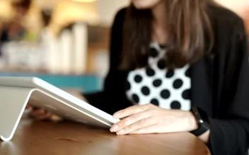 Free Stock Video Woman Syncing Her Smart Watch With Her Tablet