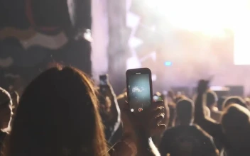 Free Stock Video Woman Recording A Concert With Her Smartphone