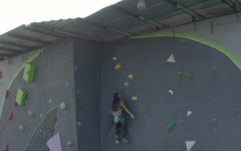 Free Stock Video Woman Reaching The Top Of A Huge Mountaineering Tower