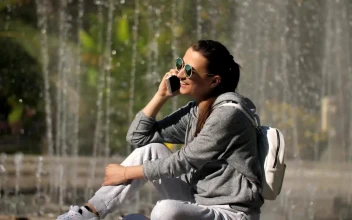 Free Stock Video Woman On A Call Next To The Fountain In A