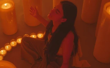 Free Stock Video Woman Meditating Sitting Among Many Candles