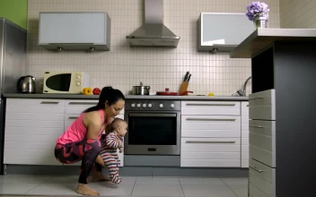 Free Stock Video Woman Doing Squats With Her Baby In Arms