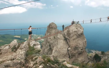 Free Stock Video Woman Crossing A Suspension Bridge In The Mountains