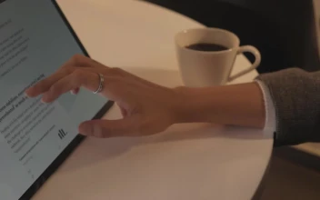 Free Stock Video Woman Browsing A News Page On A Tablet