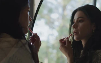 Free Stock Video Woman Applying Makeup In Front Of A Mirror