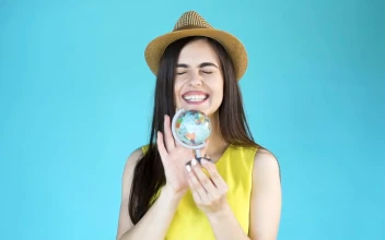 Stock Footage Woman Chooses A Country To Travel On A Globe