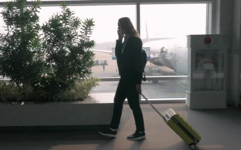 Stock Footage Woman Chatting On The Phone At An Airport