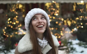 Stock Footage Woman Celebrates Snowfall And Spins In Street