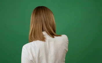 Stock Footage Woman Brushing Her Hair With A Comb