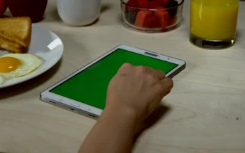 Stock Footage Woman Browsing On A Tablet