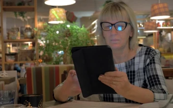 Stock Footage Woman Browsing A Tablet Before Ordering