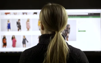 Stock Footage Woman Browsing A Fashion Website Back View