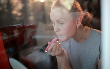 Stock Footage Woman Applying Pink Lip Gloss