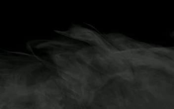 Stock Footage Wispy Smoke Floating On A Dark Background