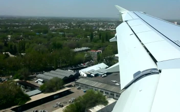 Stock Footage Window View Of An Airplane Landing In The Airport