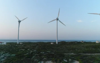 Stock Footage Wind Turbines Next To A Lighthouse