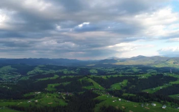 Stock Footage Wide Aerial View Of A Mountainous Valley Landscape