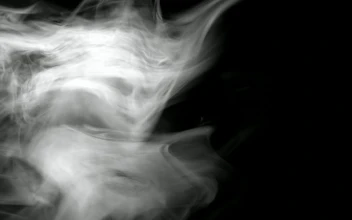Stock Footage White Smoke Floating In Front Of A Black Background