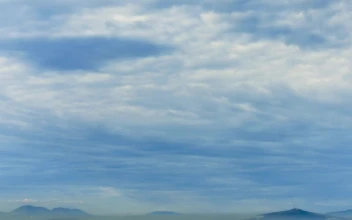 Stock Footage White Clouds Moving Over The Mountains