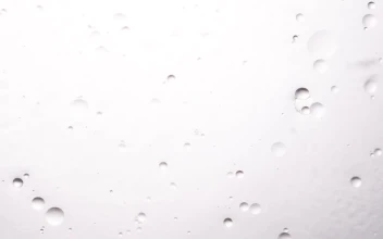 Stock Footage White Bubbles Dripping Down