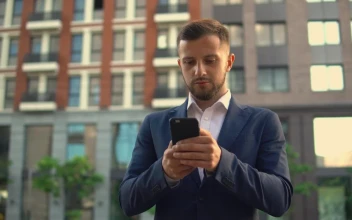 Stock Footage Well Dressed Businessman Sending Messages On His Cell Phone