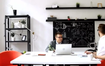 Stock Footage Web Design Team Look At Prototype In Modern Office