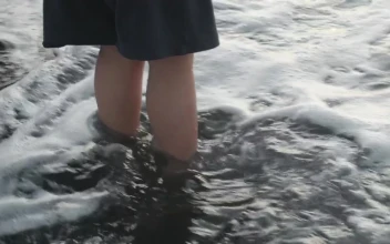 Stock Footage Waves Washing Over Feet