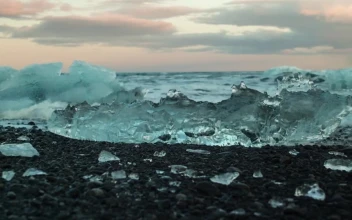 Stock Footage Waves Breaking Over Ice In The Ocean Shore