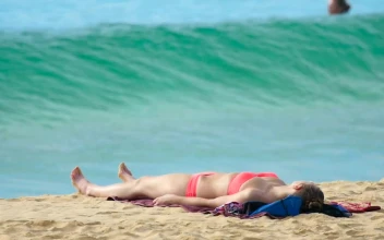 Stock Footage Wave Crashing In The Beach With A Girl In Bikini
