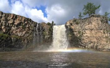 Stock Footage Waterfall With Rainbow Mist