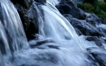 Stock Footage Waterfall Over Black Stones