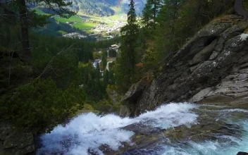 Stock Footage Waterfall In The Forest With A Town And A Rainbow