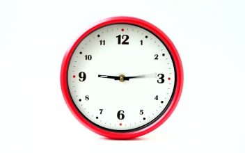 Stock Footage Wall Clock With Red Frame