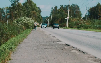 Stock Footage Walking Down A Rural Road With A Sign