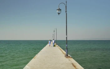 Stock Footage Walking Along A Concrete Pier