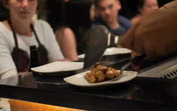 Stock Footage Waiter Serving Meat Stew In A Restaurant