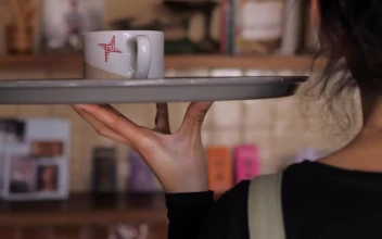 Stock Footage Waiter Carries A Cup Of Coffee To Customer