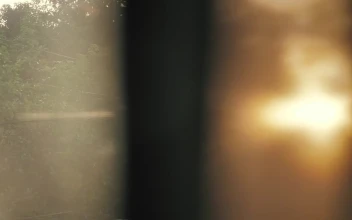 Stock Footage View Of A Window With A Curtain