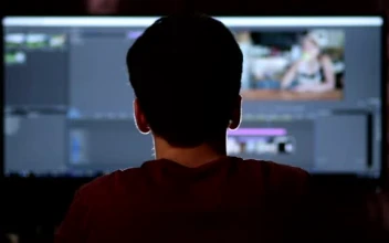 Stock Footage Video Editor Working On A Large Screen Small