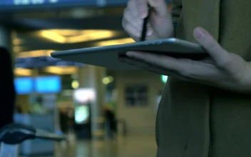 Stock Footage Using A Tablet At An Airport