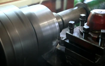 Stock Footage Using A Lathe To Cut Metal