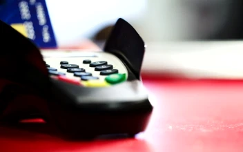 Stock Footage Using A Card Machine At The Counter
