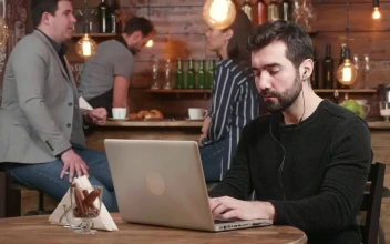 Stock Footage Urban Man Typing On Laptop Is Served Coffee In Hip