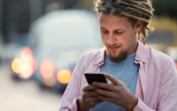 Stock Footage Urban Man Smiles At Social Media App In Street