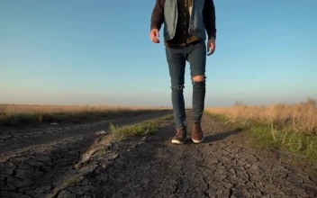 Stock Footage Unknown Man Walking In A Dirt Road