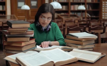 Stock Footage University Student Researching With Books In Library