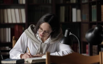 Stock Footage University Student Prepares For Exam In Library